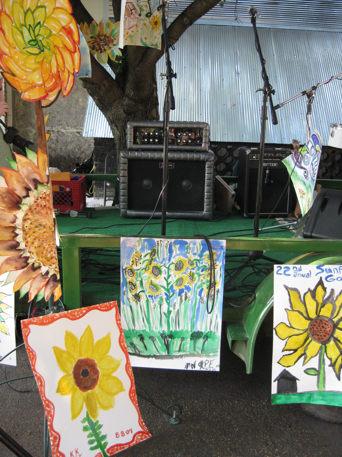 A display of sunflower-themed artwork made by festival-goers