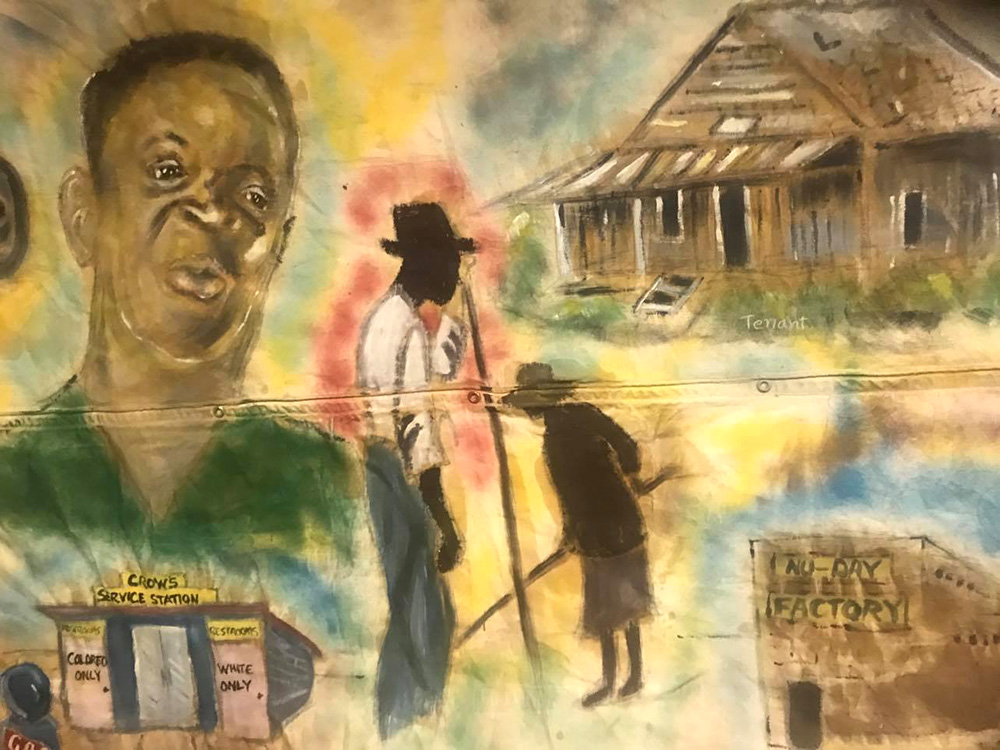 This photo depicts a segment of the 34-foot mural that Bobby Whalen painted to document the history of the civil rights movement in Mississippi. Photo courtesy of the artist.